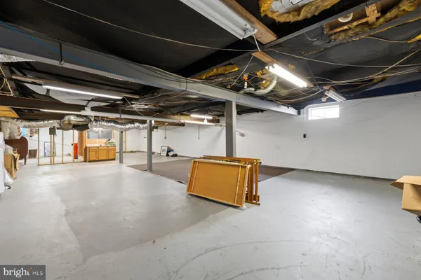 a view of an empty room with storage