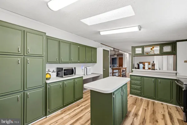 a room with cabinets and washer