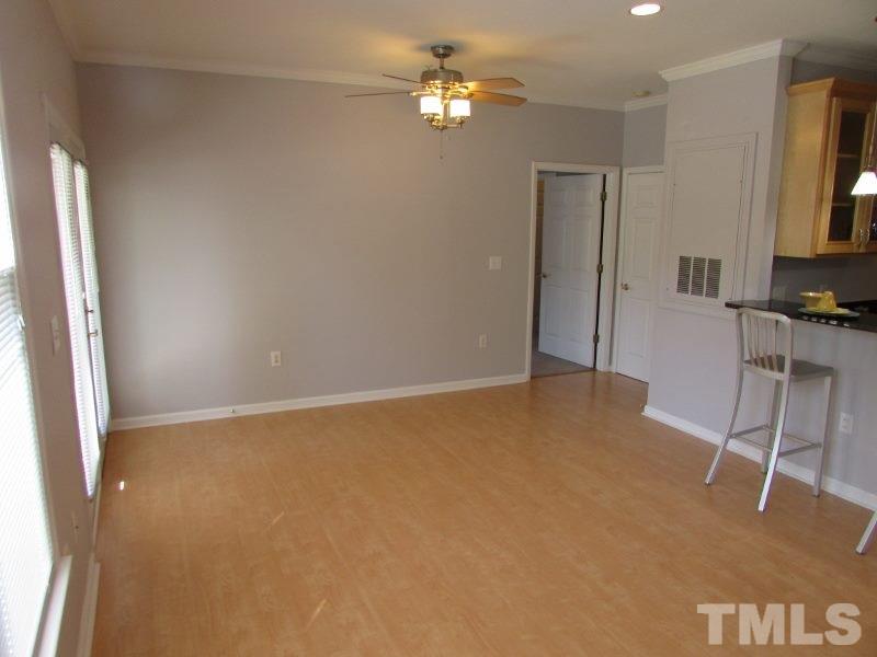 720 North Person Street, Unit 103 Raleigh, NC 27604 - Photo 4 of 13 a view of an empty room with a window