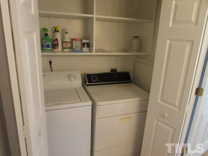 720 North Person Street, Unit 103 Raleigh, NC 27604 - Photo 8 of 13 a utility room with dryer and washer