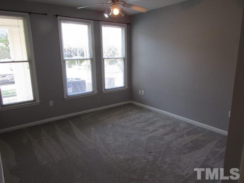 720 North Person Street, Unit 103 Raleigh, NC 27604 - Photo 10 of 13 an empty room with a window