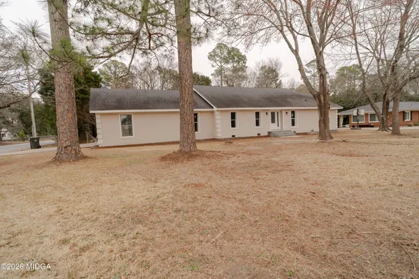 front view of a house with a yard