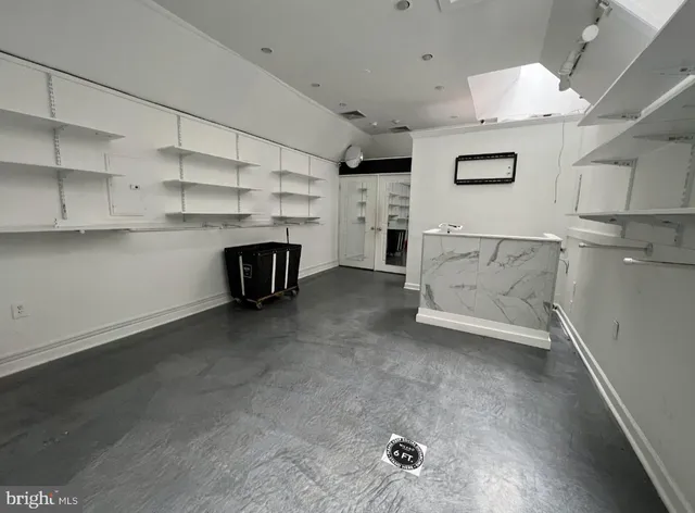 a view of kitchen and cabinets