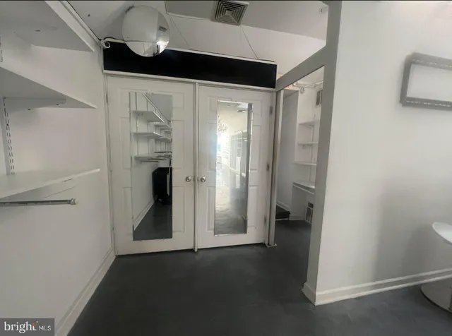 a view of an empty walk in closet