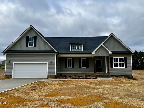 a front view of a house with yard