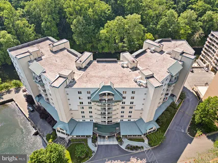 an aerial view of a house with outdoor space