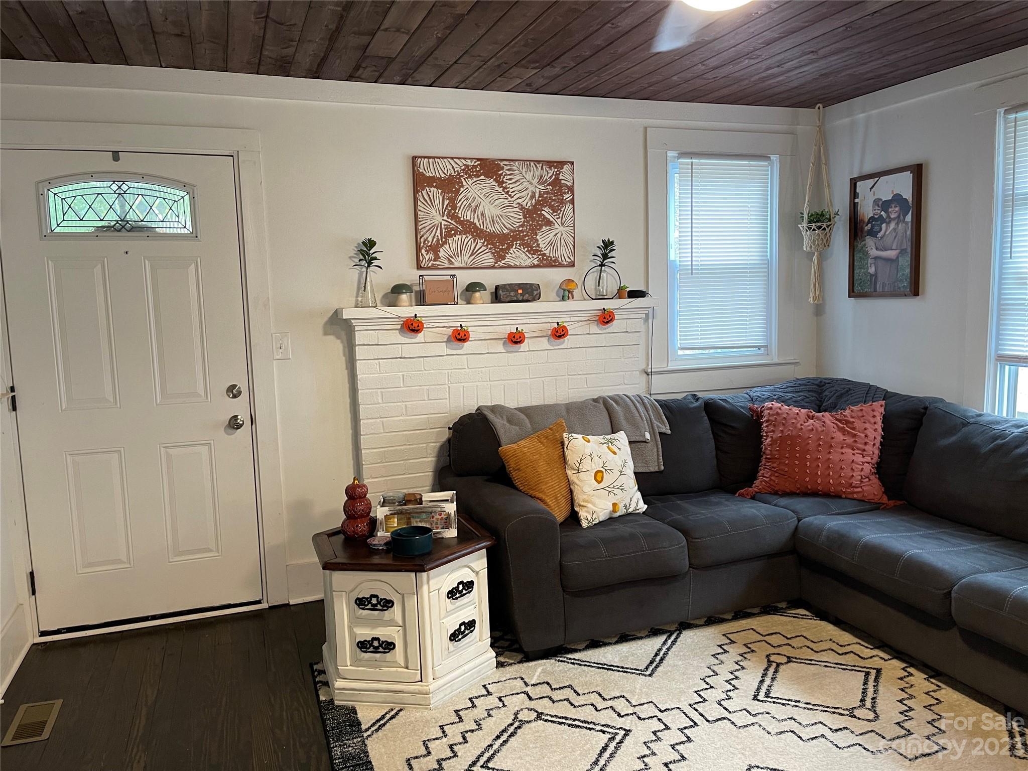 499 Union Cemetery Road Southwest Concord, NC 28027 - Photo 3 of 19 a living room with furniture and a wall painting