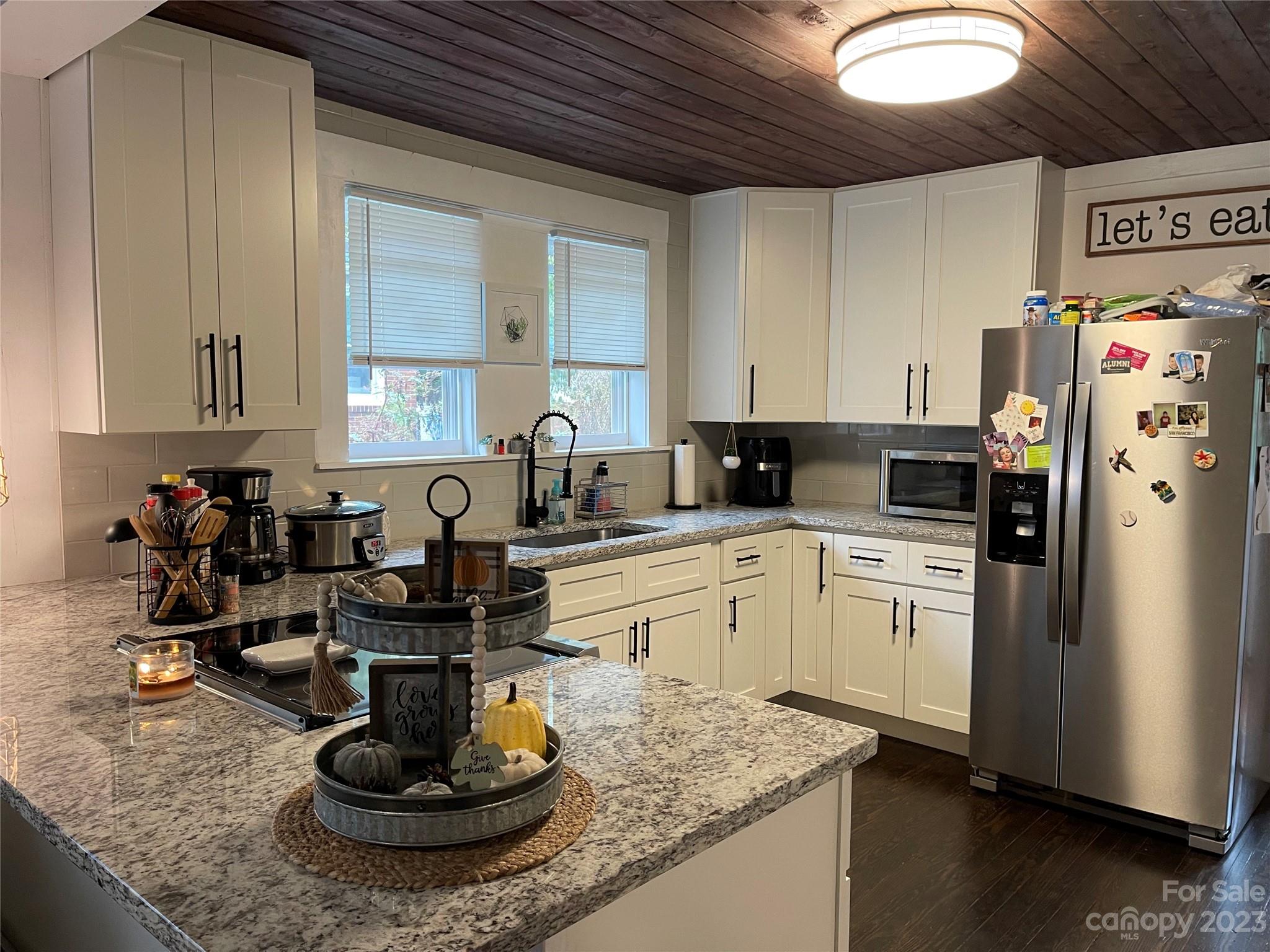 499 Union Cemetery Road Southwest Concord, NC 28027 - Photo 6 of 19 a kitchen with a refrigerator and a sink
