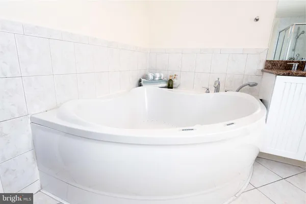a white bath tub sitting in a bathroom