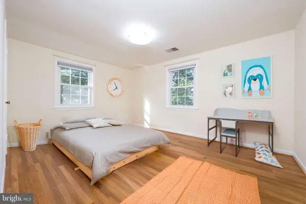 a bedroom with a bed and a table