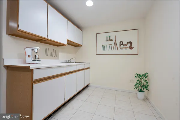 a kitchen with a sink and cabinets
