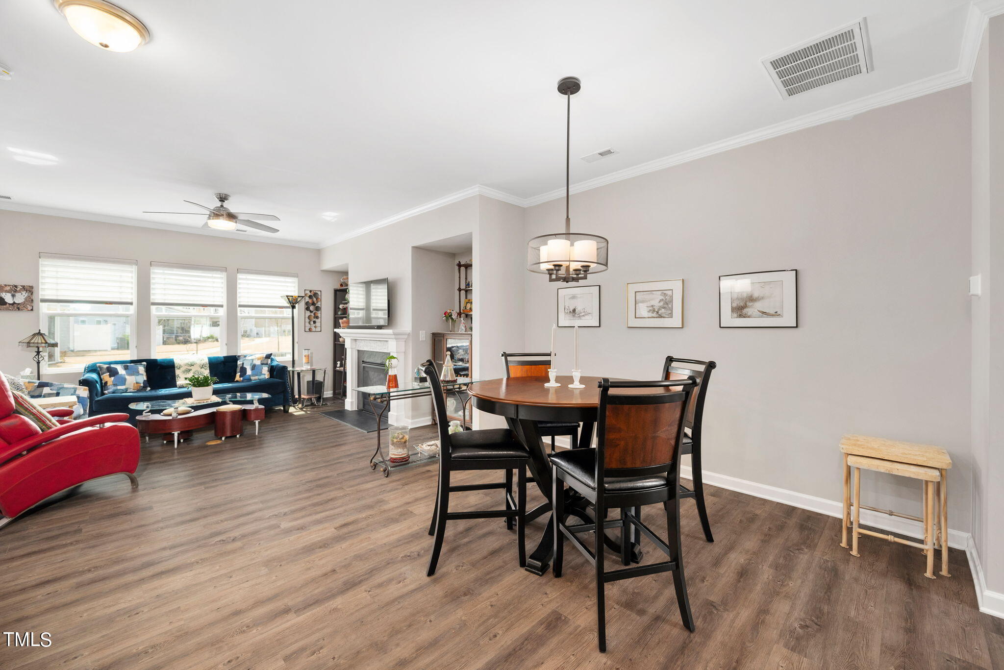 1016 Epiphany Road Morrisville, NC 27560 - Photo 11 of 45 a view of a dining room with furniture window and wooden floor