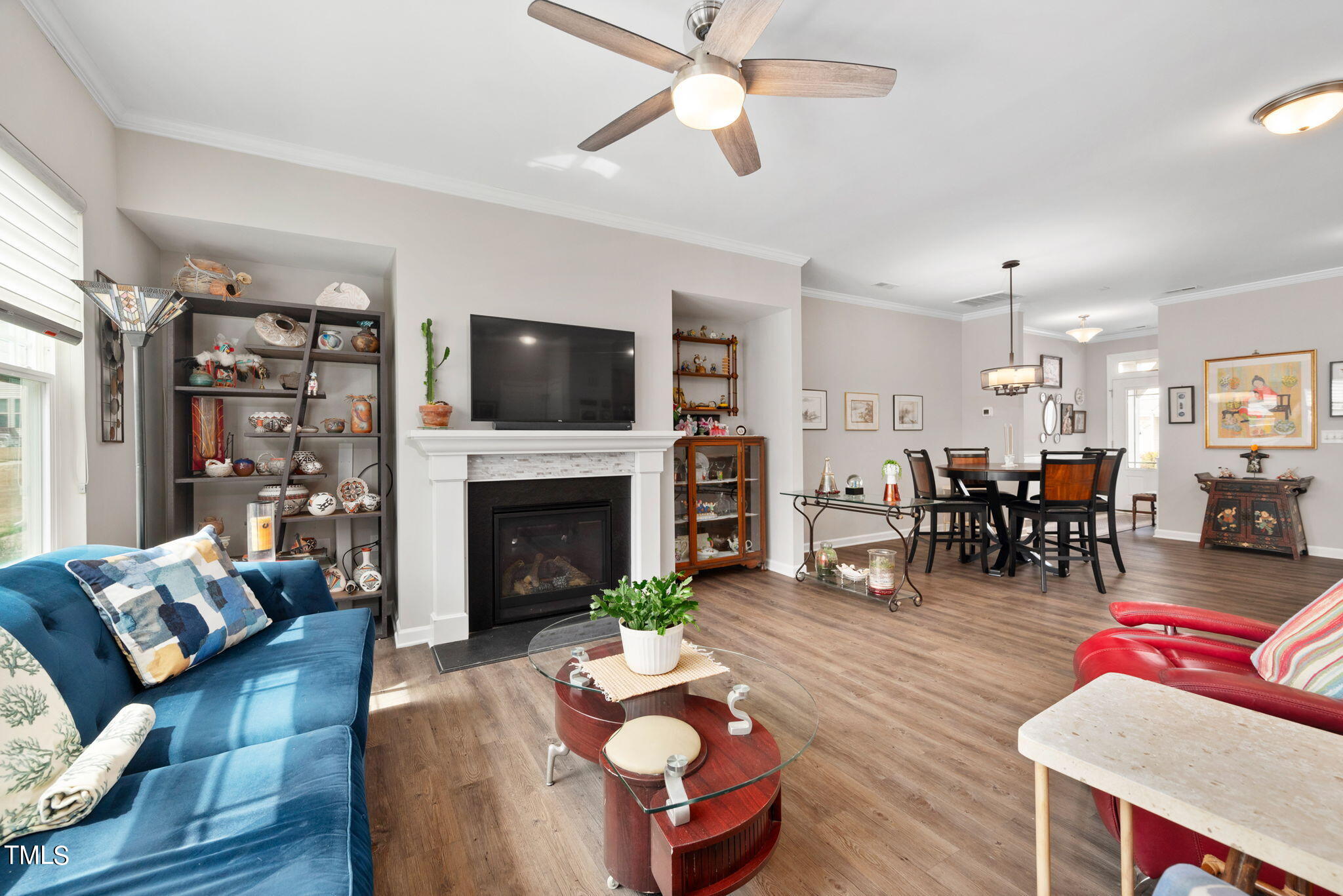 1016 Epiphany Road Morrisville, NC 27560 - Photo 14 of 45 a living room with furniture a fireplace and a flat screen tv