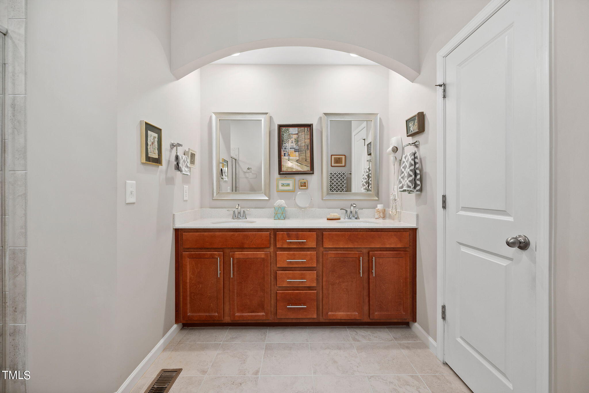 1016 Epiphany Road Morrisville, NC 27560 - Photo 22 of 45 a spacious bathroom with a granite countertop sink and a mirror