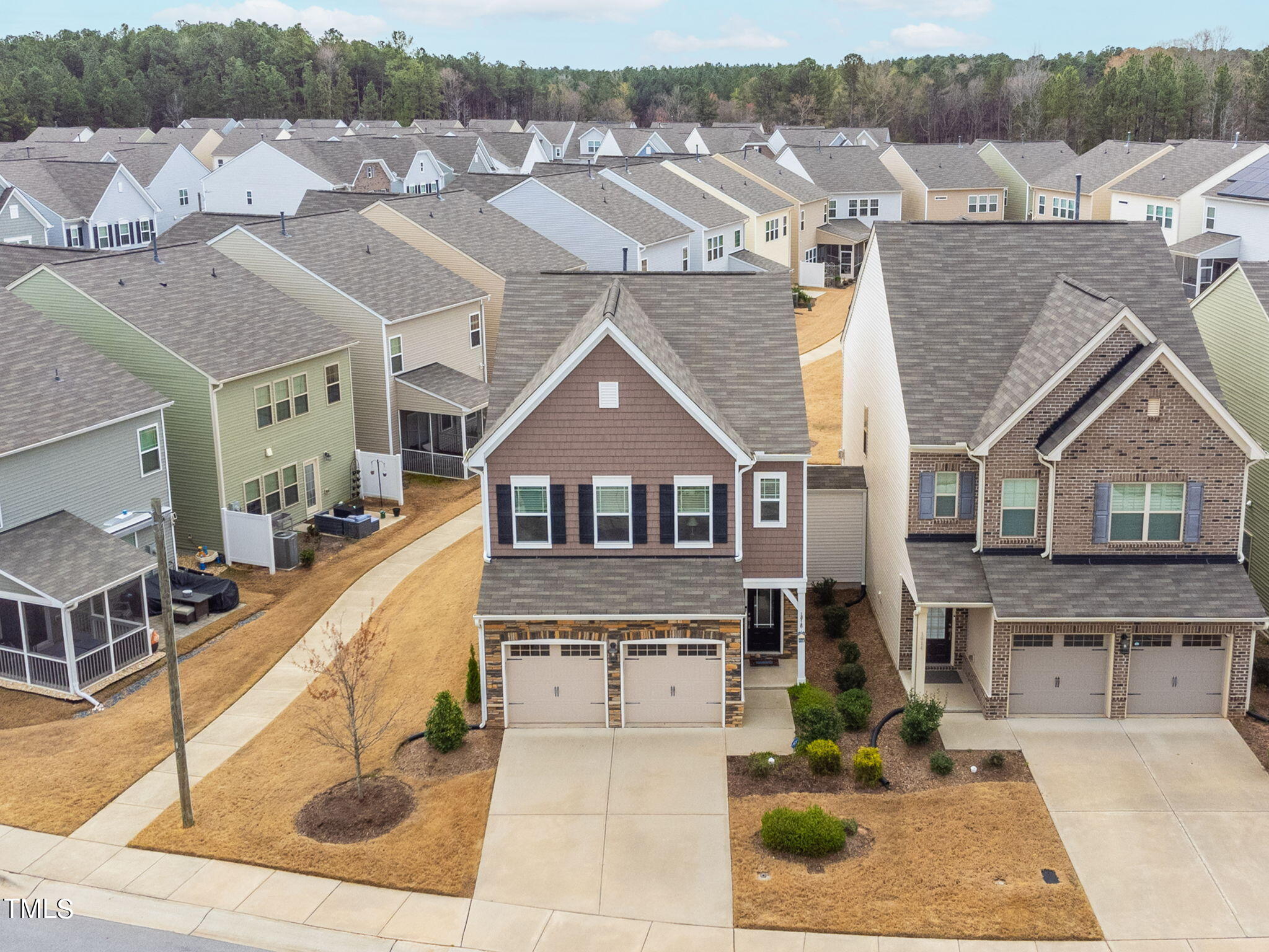 1016 Epiphany Road Morrisville, NC 27560 - Photo 45 of 45 a view of a big house with a big yard plants and large tree