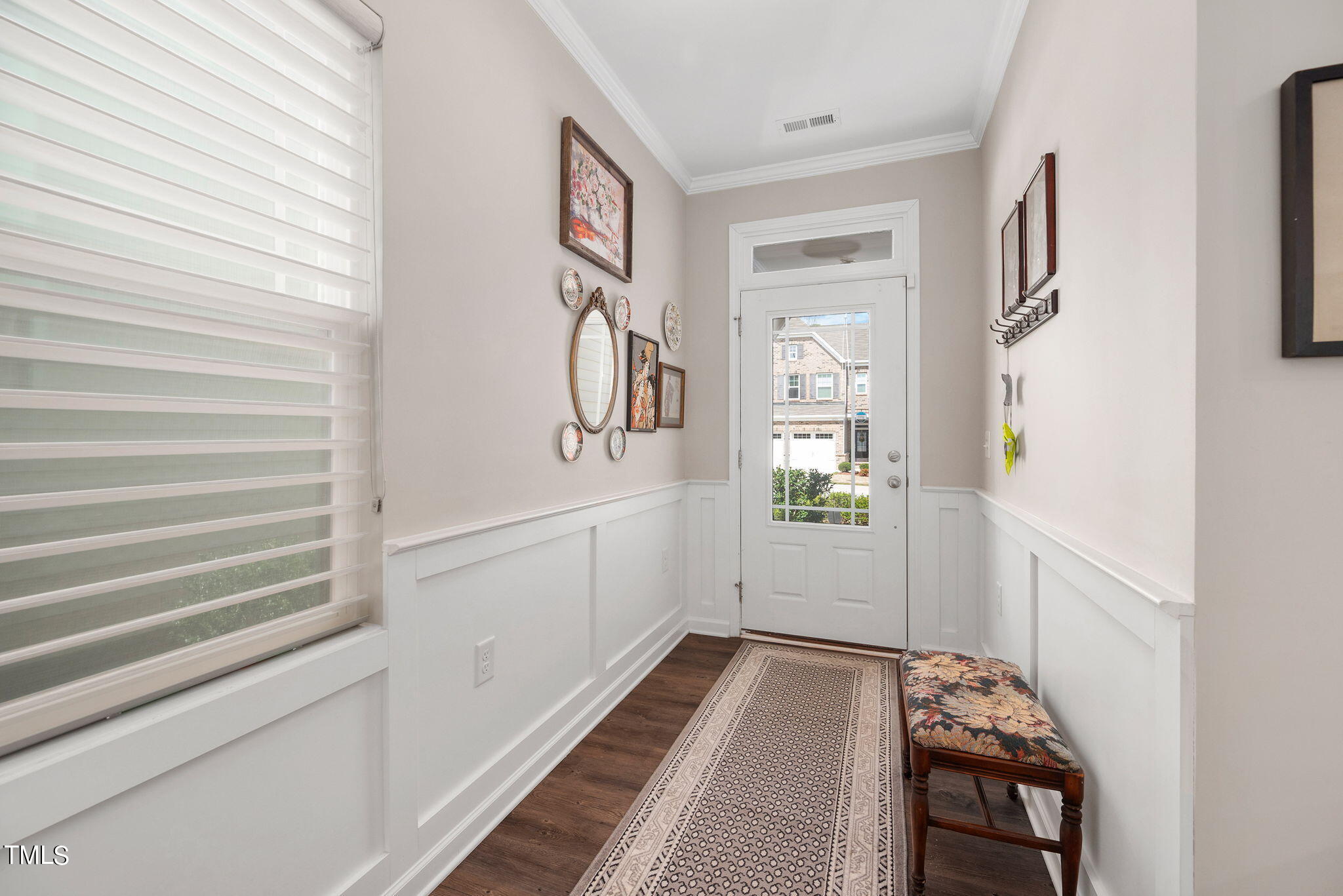 1016 Epiphany Road Morrisville, NC 27560 - Photo 6 of 45 a hallway with wooden floor and windows