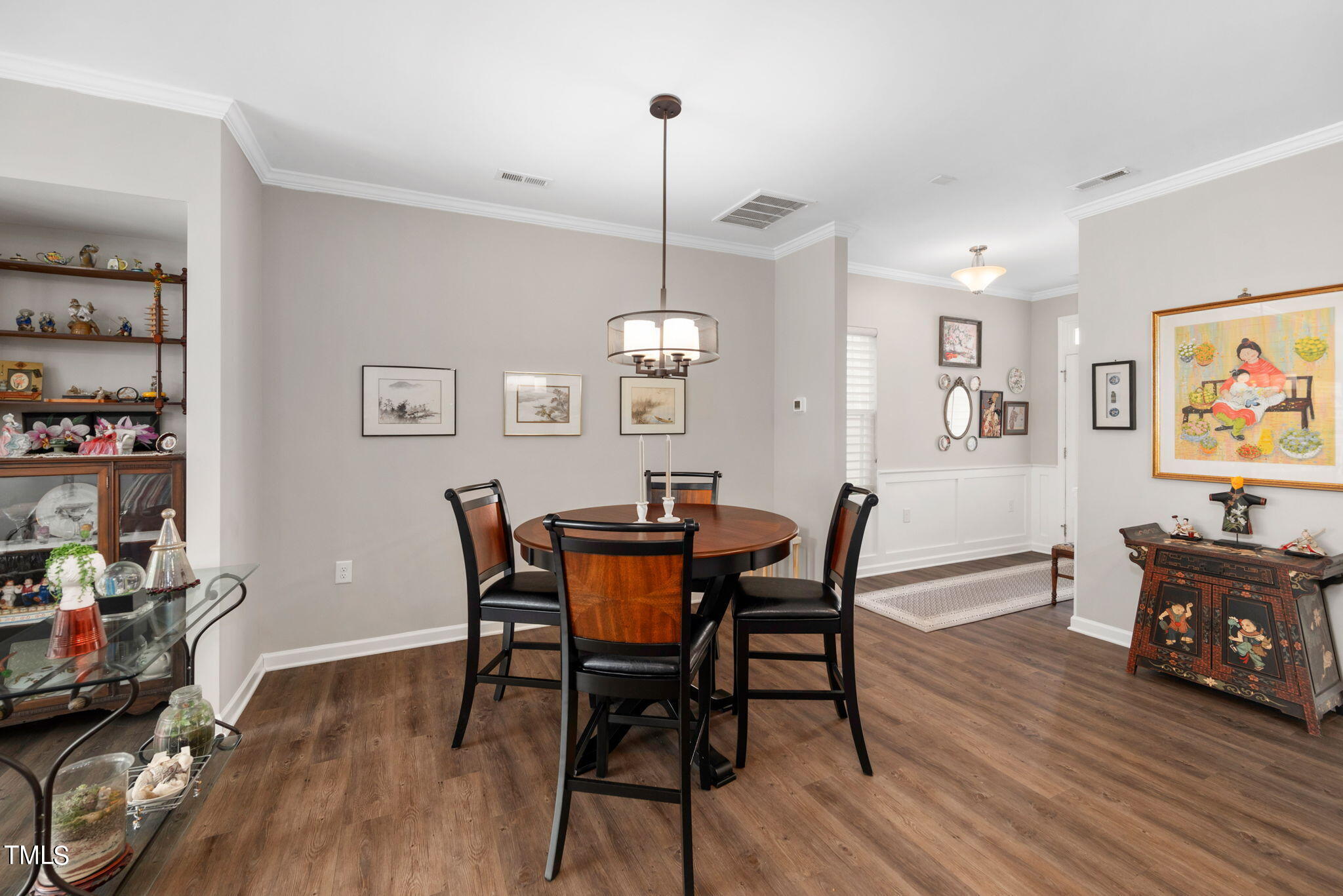 1016 Epiphany Road Morrisville, NC 27560 - Photo 7 of 45 a view of a dining room with furniture wooden floor and a chandelier