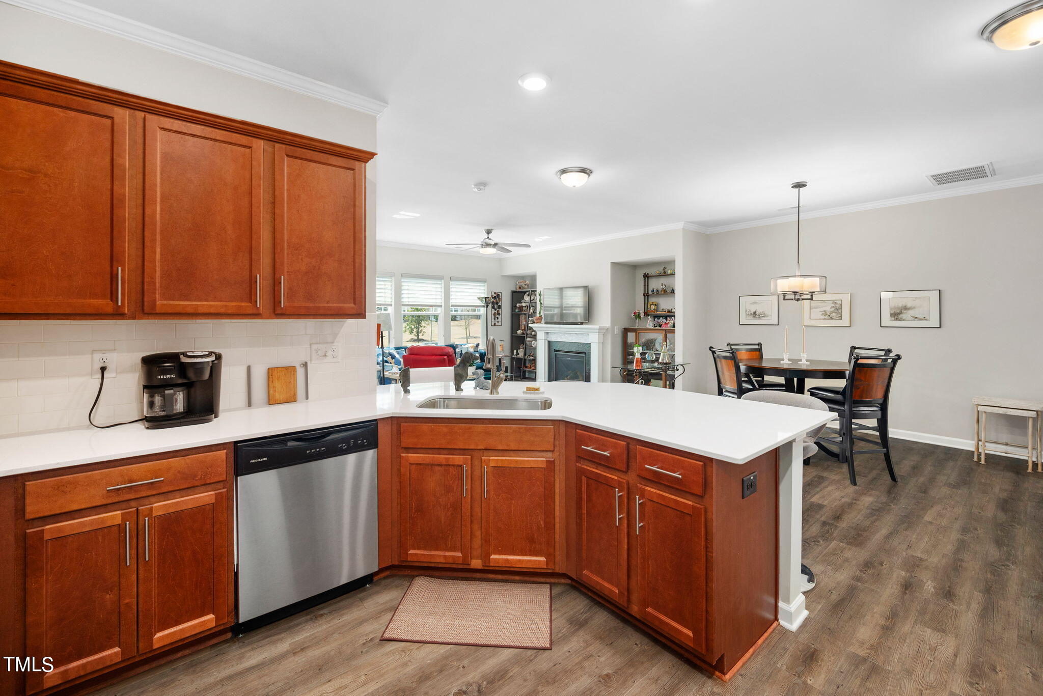1016 Epiphany Road Morrisville, NC 27560 - Photo 10 of 45 a kitchen with a sink cabinets and wooden floor
