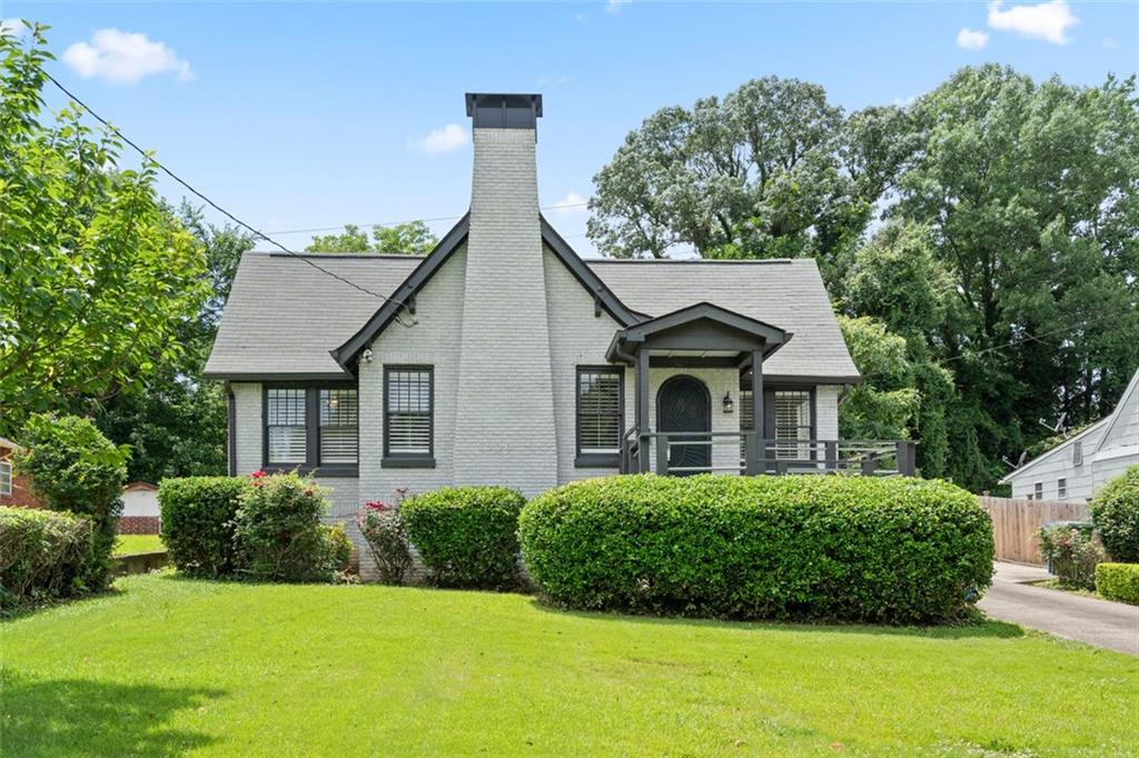 2306 Boulevard Granada Southwest Atlanta, GA 30311 - Photo 1 of 1 a front view of a house with a yard