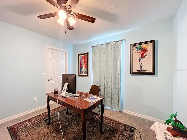 a view of a workspace with furniture