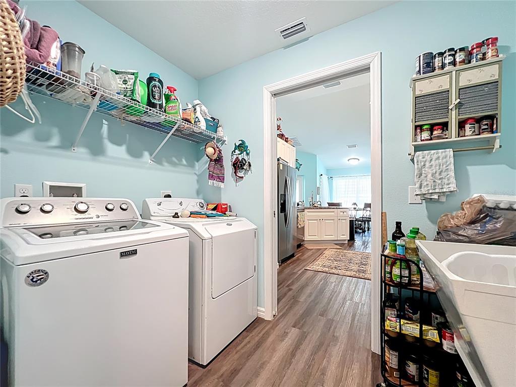 4501 East Ravenna Street Inverness, FL 34453 - Photo 23 of 31 a storage room with washer and dryer