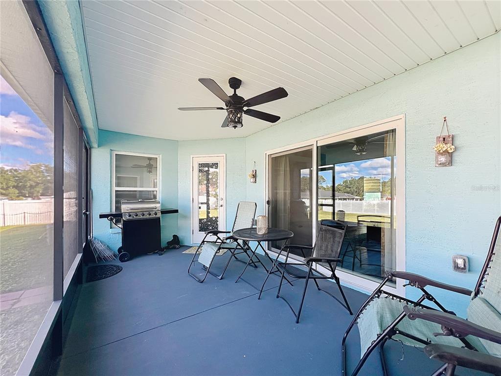 4501 East Ravenna Street Inverness, FL 34453 - Photo 24 of 31 a living room with furniture and a large window with wooden floor