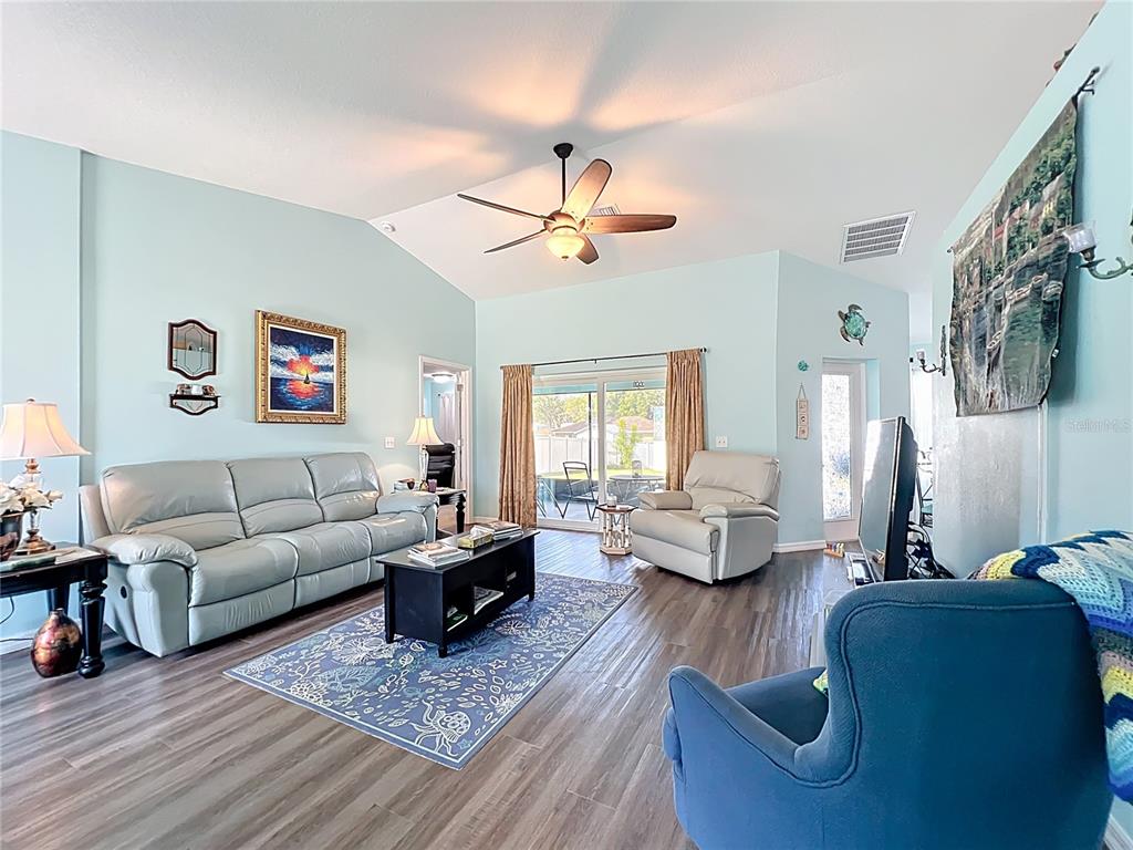4501 East Ravenna Street Inverness, FL 34453 - Photo 5 of 31 a living room with furniture or couch and a wooden floor