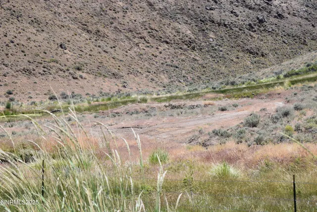 a view of a lot of a house with a yard