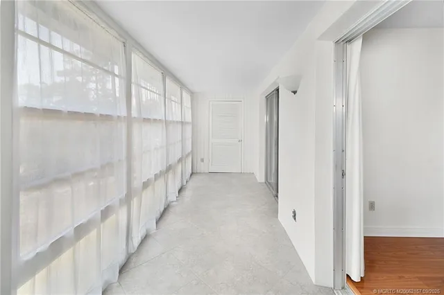 a view of entryway with wooden floor