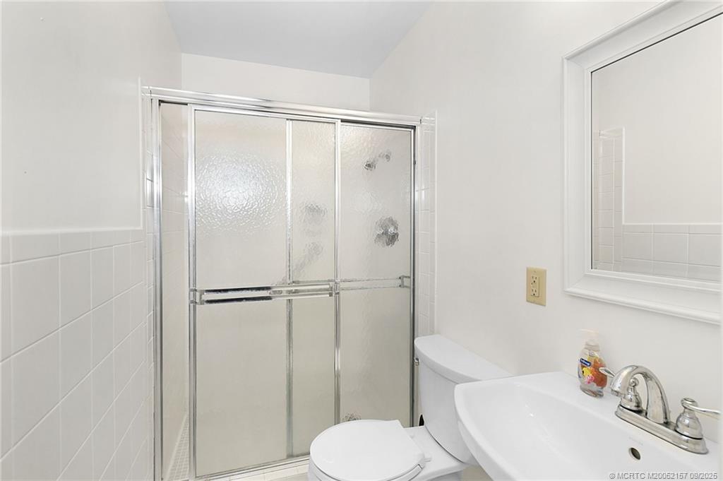 2600 Southeast Ocean Boulevard, Unit H15 Stuart, FL 34996 - Photo 14 of 27 a bathroom with a sink toilet and shower