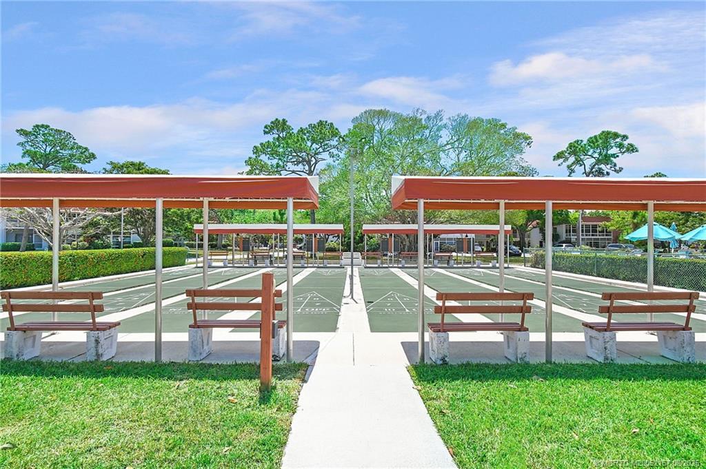 2600 Southeast Ocean Boulevard, Unit H15 Stuart, FL 34996 - Photo 20 of 27 a view of yard with swimming pool and green space