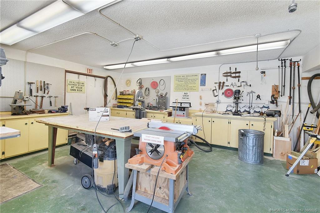 2600 Southeast Ocean Boulevard, Unit H15 Stuart, FL 34996 - Photo 21 of 27 a kitchen that has a lot of white cabinets and stainless steel appliances