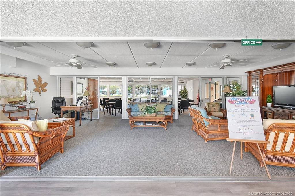 2600 Southeast Ocean Boulevard, Unit H15 Stuart, FL 34996 - Photo 25 of 27 a living room with furniture and a flat screen tv