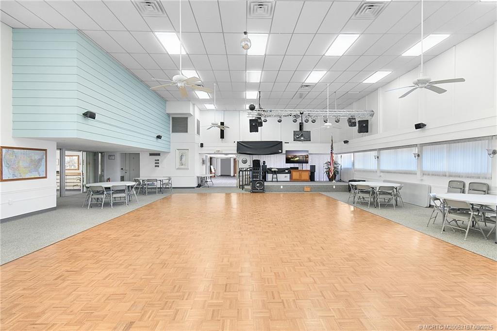 2600 Southeast Ocean Boulevard, Unit H15 Stuart, FL 34996 - Photo 26 of 27 a large white kitchen with lots of counter space and chandelier