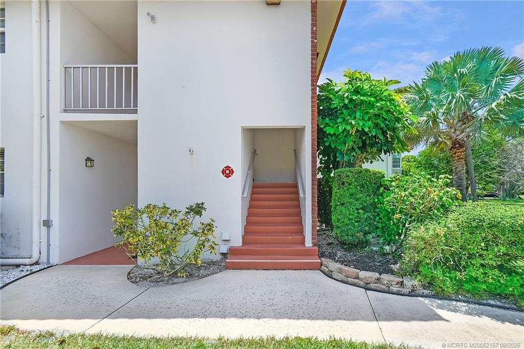 2600 Southeast Ocean Boulevard, Unit H15 Stuart, FL 34996 - Photo 4 of 27 a view of a entryway door with flower plants