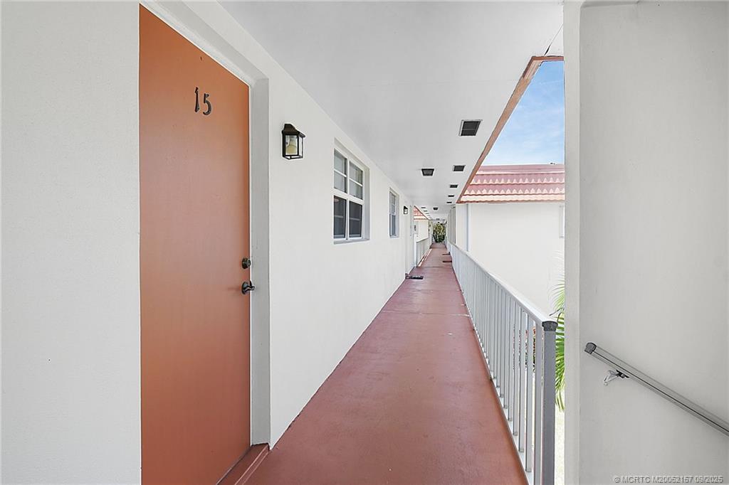 2600 Southeast Ocean Boulevard, Unit H15 Stuart, FL 34996 - Photo 5 of 27 a view of a hallway with the white walls and stairs