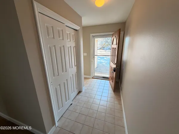a view of room with window and wooden floor