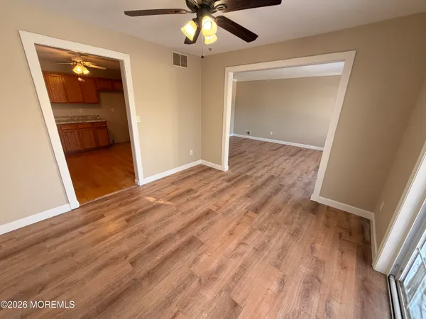 a large kitchen with stainless steel appliances granite countertop a sink dishwasher stove and cabinets