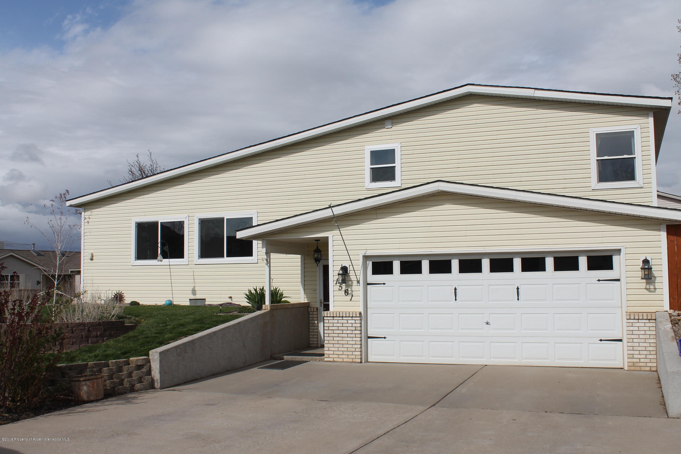 1561 East 12th Street Rifle, CO 81650 - Photo 1 of 23 a front view of a house with windows