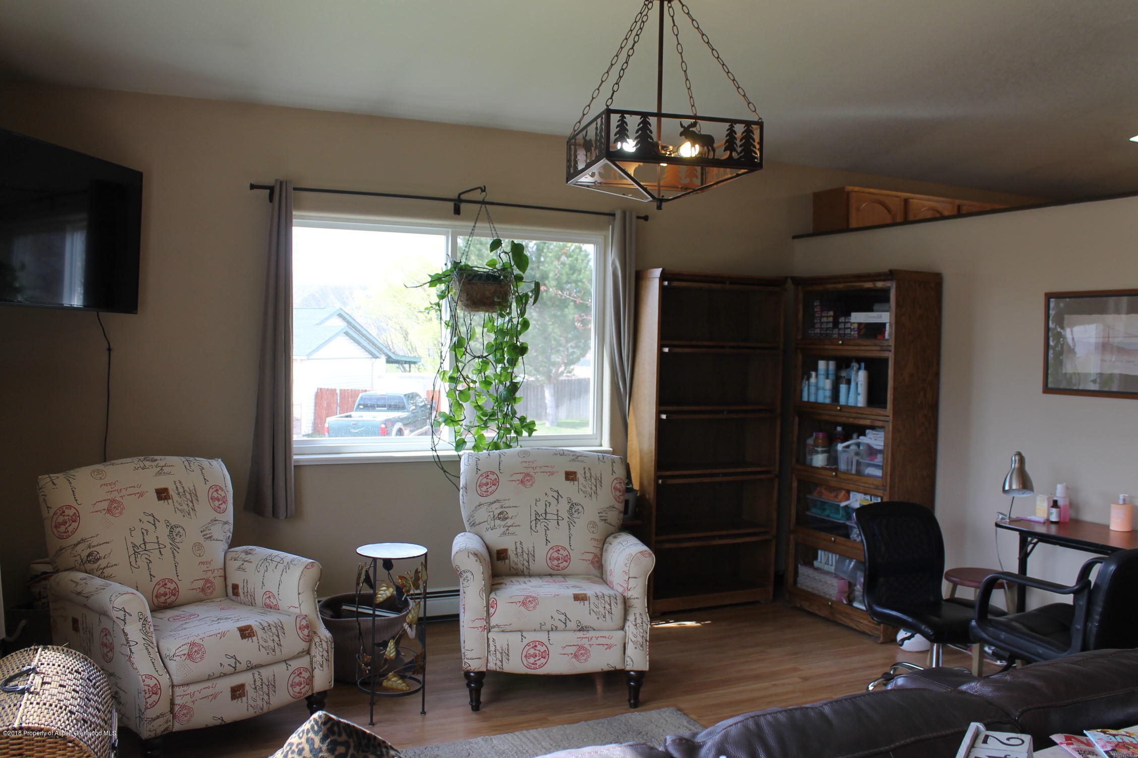 1561 East 12th Street Rifle, CO 81650 - Photo 6 of 23 a living room with furniture and a window