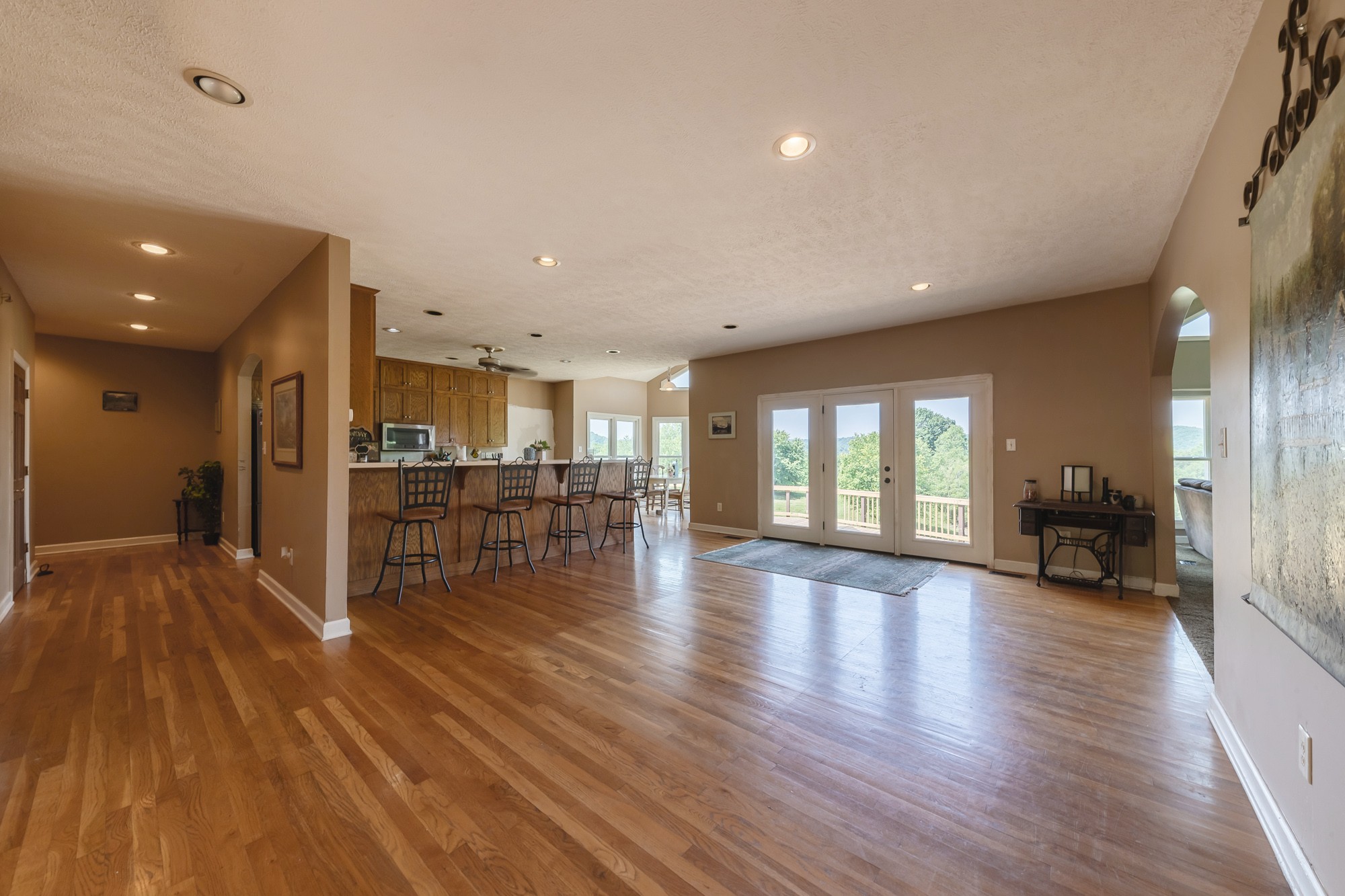 2150 Wilson Hill Road Lewisburg, TN 37091 - Photo 23 of 38 a view of a living room and kitchen with furniture wooden floor