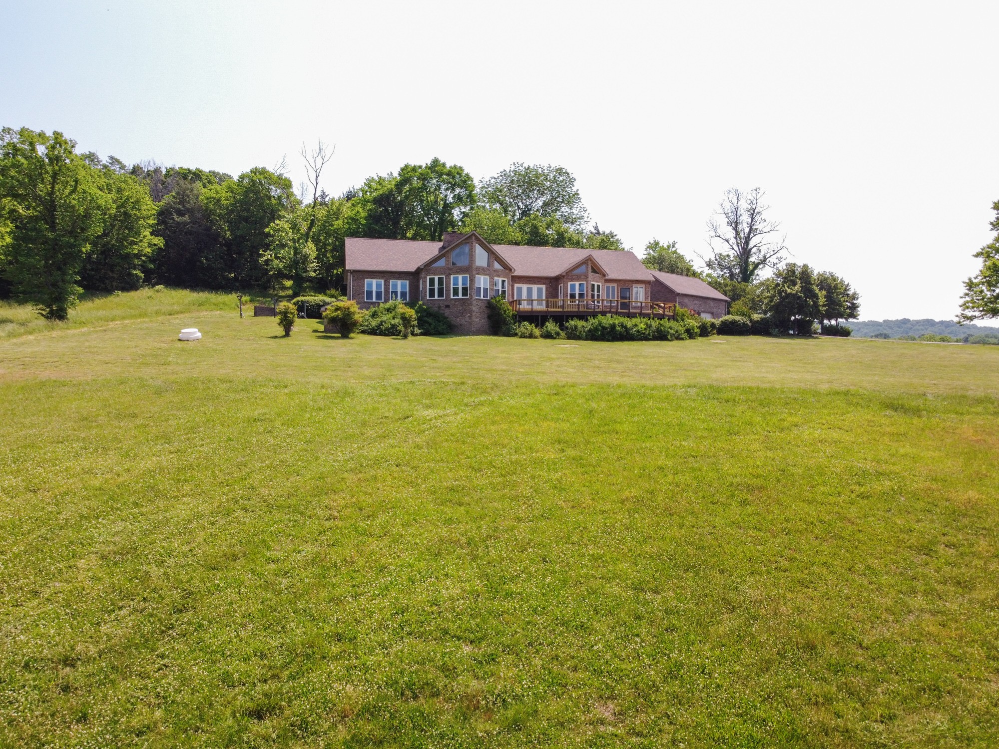 2150 Wilson Hill Road Lewisburg, TN 37091 - Photo 5 of 38 a view of a large pool with lawn chairs under an umbrella