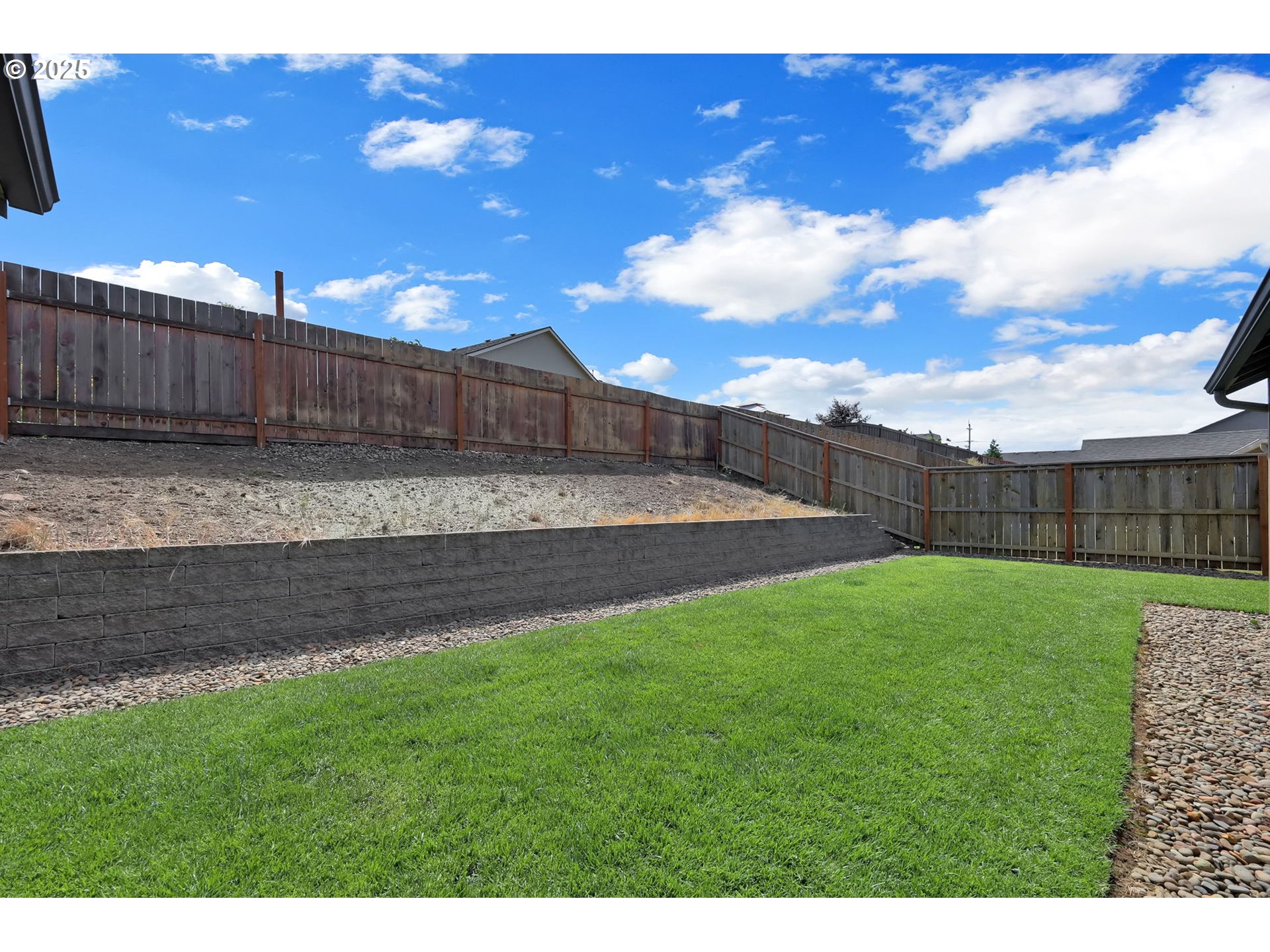 2057 South 59th Street Springfield, OR 97478 - Photo 26 of 28 a view of a backyard with wooden fence
