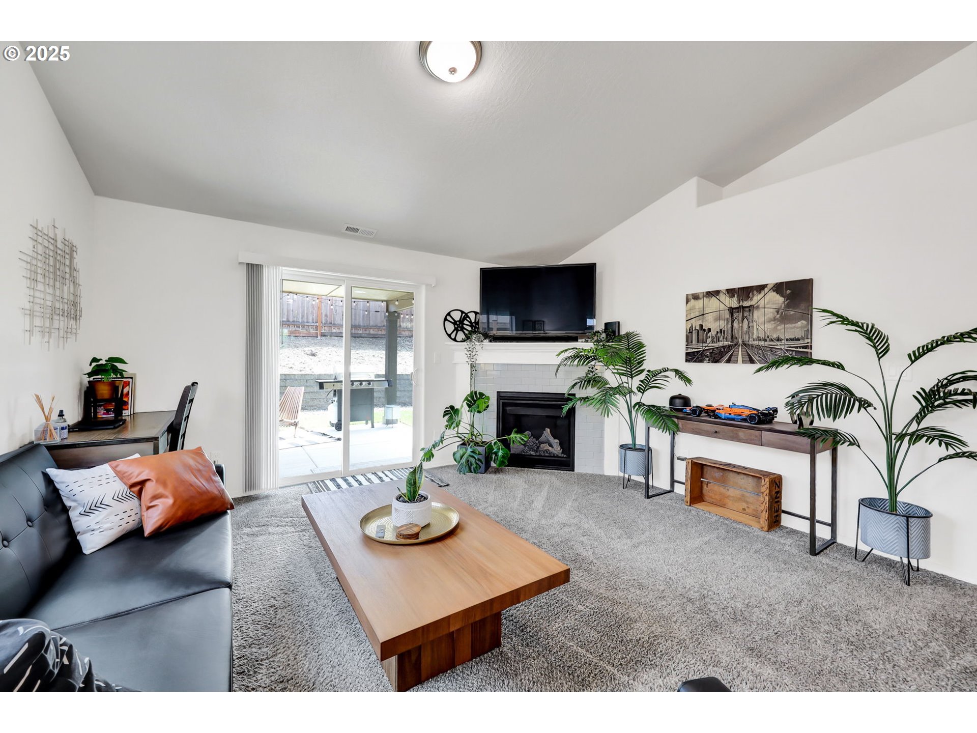 2057 South 59th Street Springfield, OR 97478 - Photo 5 of 28 a living room with furniture fireplace and flat screen tv