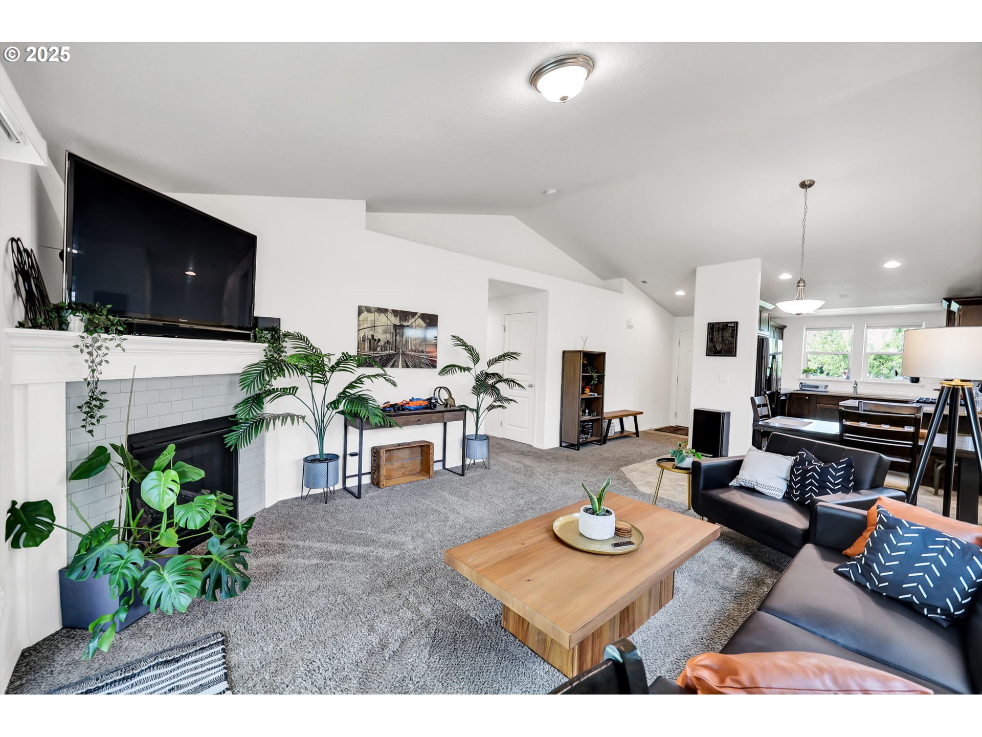 2057 South 59th Street Springfield, OR 97478 - Photo 6 of 28 a living room with furniture and a flat screen tv