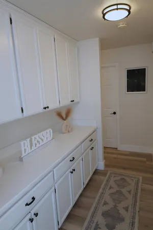 a view of entryway with livingroom and chandelier