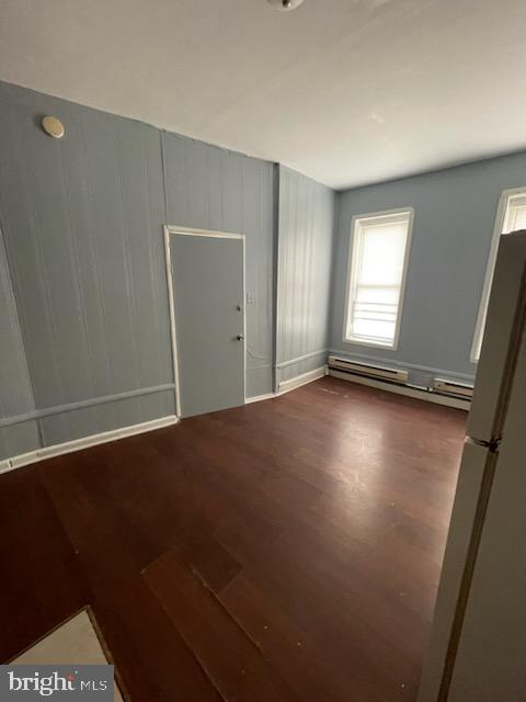 3412 North Front Street Philadelphia, PA 19140 - Photo 10 of 10 an empty room with wooden floor and windows