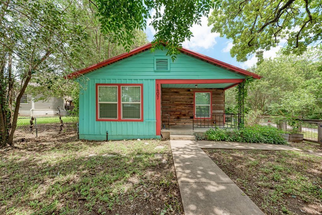 1407 Leona Street, Unit A Austin, TX 78702 - Photo 2 of 25 View of front facade with board and batten siding and a porch