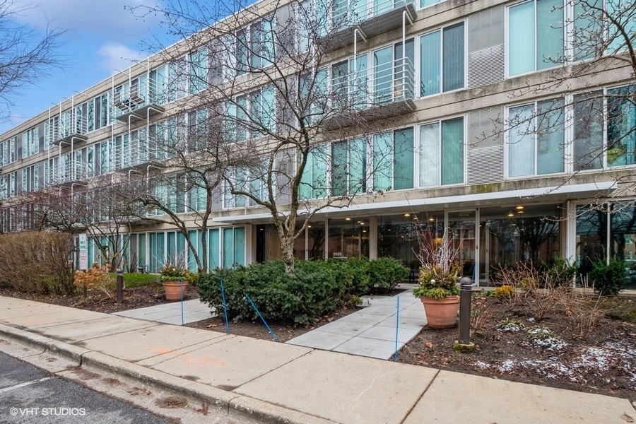 2555 Gross Point Road, Unit 201 Evanston, IL 60201 - Photo 1 of 15 a front view of a building with garden
