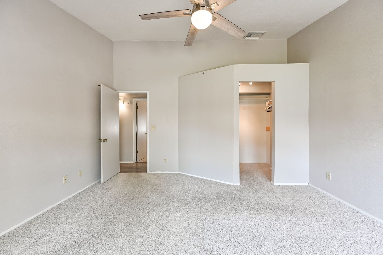 131 Chambers Street Ridgecrest, CA 93555 - Photo 14 of 28 an empty room with closet and a ceiling fan